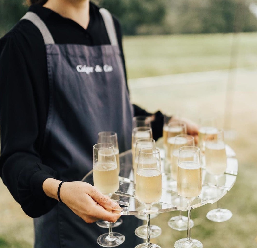 Woman holding champagne tray effortlessly